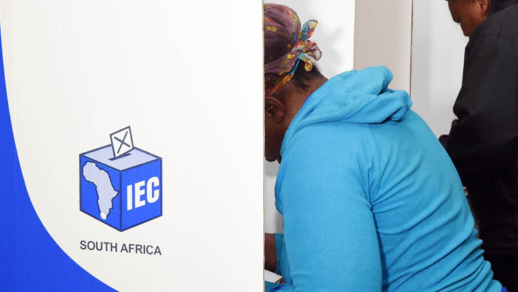 A person casts a vote during an election