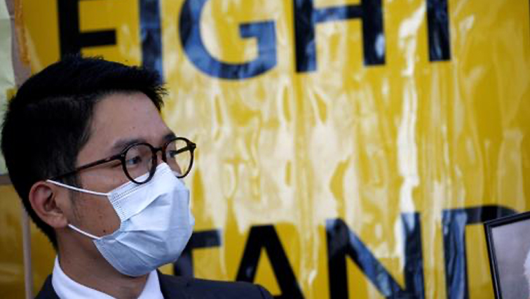 Hong Kong exile pro-democracy activist Nathan Law wearing a face mask holds a rally with other activist groups.
