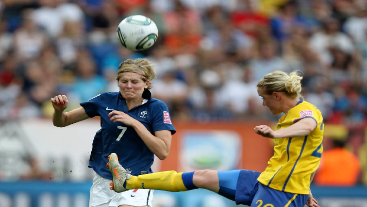 Corine Franco (L) of France is challenged by Sweden's Marie Hammarstrom during their Women's World Cup third place soccer match in Sinsheim.