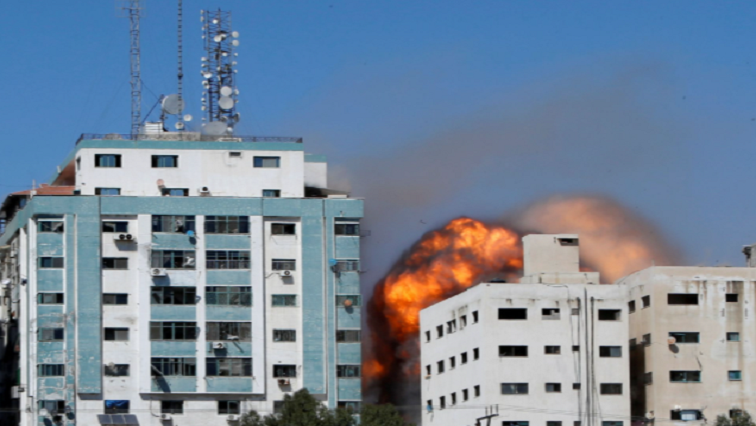 A tower housing AP, Al Jazeera offices collapses after Israeli missile strikes in Gaza city, on May 15, 2021.