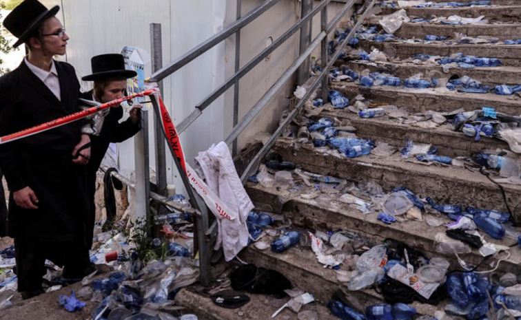 Ultra Orthodox Jews look at stairs with waste on it in Mount Meron, northern Israel, where fatalities were reported among the thousands who had gathered at the tomb of a 2nd-century sage for annual commemorations.