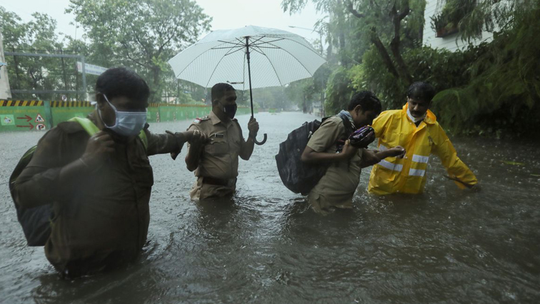 More than 200 000 people have been evacuated from their homes in Gujarat as authorities shut ports and major airports.