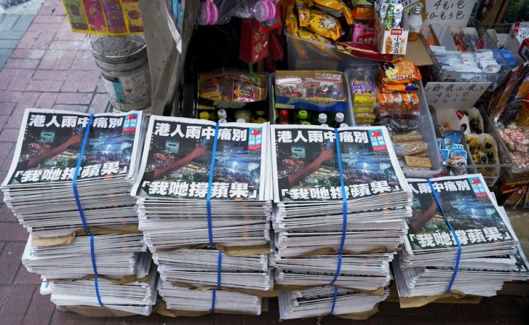 Copies of the final edition of Apple Daily, published by Next Digital, are seen at a newsstand in Hong Kong, China June 24, 2021