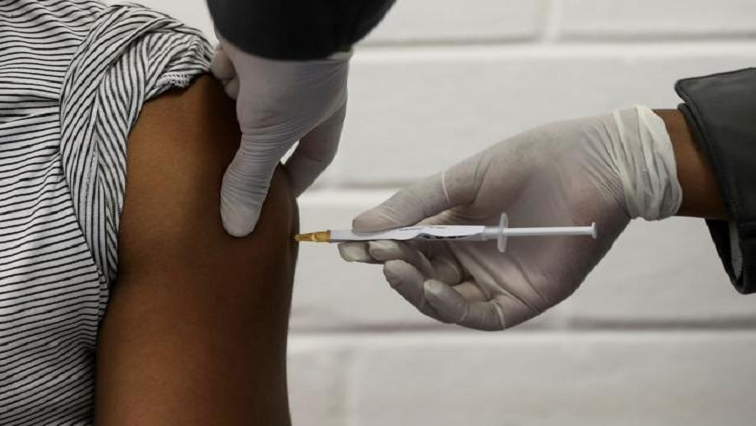 A health worker administers  vaccine against the coronavirus disease (COVID-19) during a vaccination drive