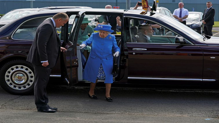 Britain's Queen Elizabeth and Prince William, Duke of Cambridge, known as the Earl of Strathearn in Scotland, (not pictured) arrive for a visit to AG Barr's factory, where the Irn-Bru drink is manufactured.