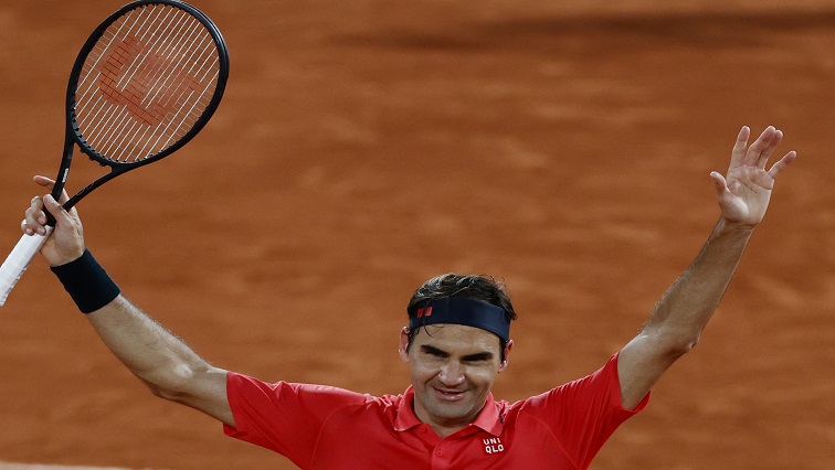 Switzerland's Roger Federer celebrates after winning his third round match at Roland Garros.