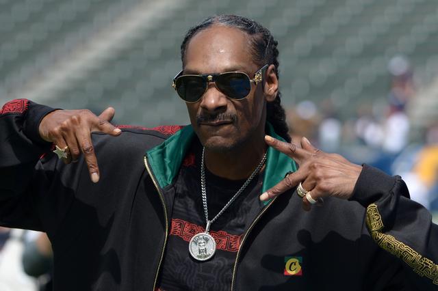 FILE PHOTO: Sep 22, 2019; Carson, CA, USA; Music artist Snoop Dogg gestures before the game between the Houston Texans and Los Angeles Chargers at Dignity Health Sports Park.