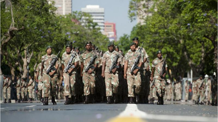 South African National Defence Force (SANDF) soldiers parade on the streets near the Union Buildings in 2013.