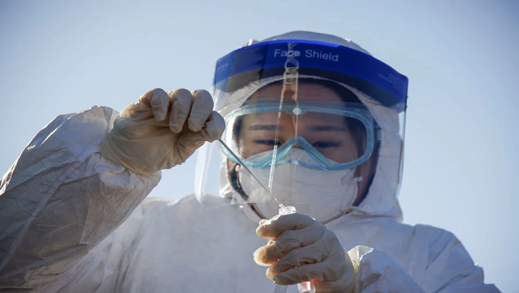 A member of the medical personnel works at a coronavirus disease (COVID-19) testing site which is temporarily set up at a railway station in Seoul, South Korea, on December 15, 2020.