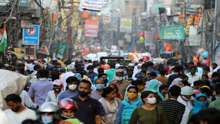 People are seen at a market amidst the spread of the coronavirus disease (COVID-19), in the old quarters of Delhi, October 19, 2020.