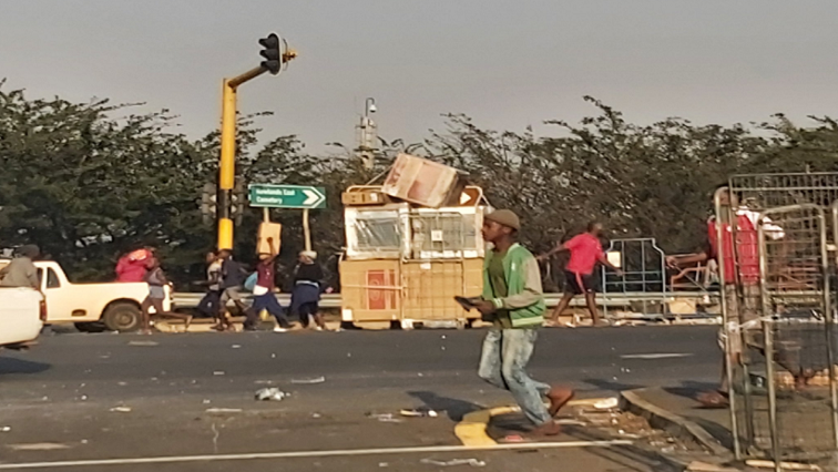 Durban resident’s looting shops.