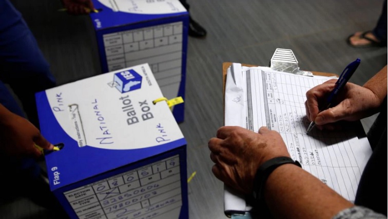 Election officials seal ballot boxes at the end of voting in South Africa's parliamentary and provincial elections at a polling station in Johannesburg, South Africa, on May 8, 2019.