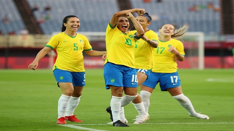 Marta of Brazil celebrates scoring their third goal.
