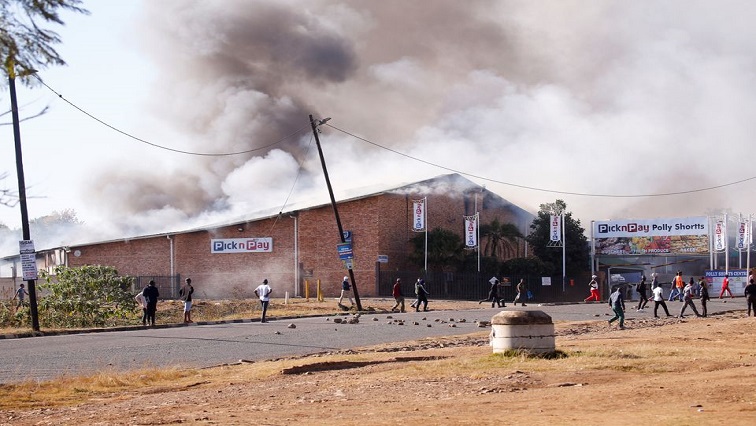 A supermarket burns as protests continue after former president Jacob Zuma was jailed, in Pietermaritzburg.