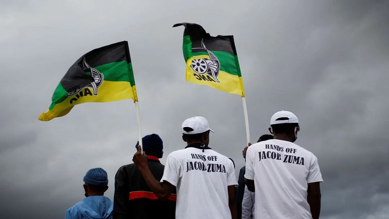 Supporters of former South African President Jacob Zuma wait for him to speak, as South African court agreed to hear Zuma's challenge to a 15-month jail term for failing to attend a corruption hearing, in Nkandla.