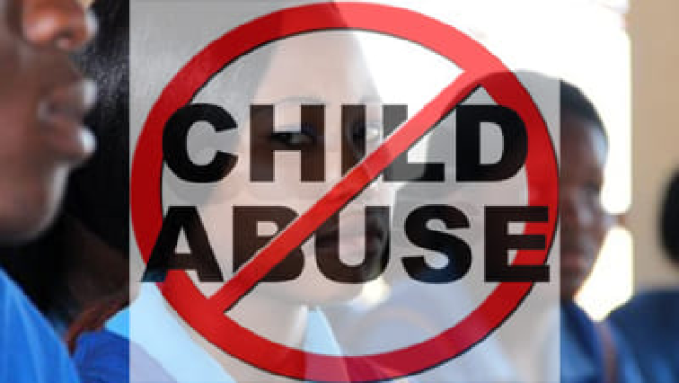 A sign advocating for an end to child abuse.