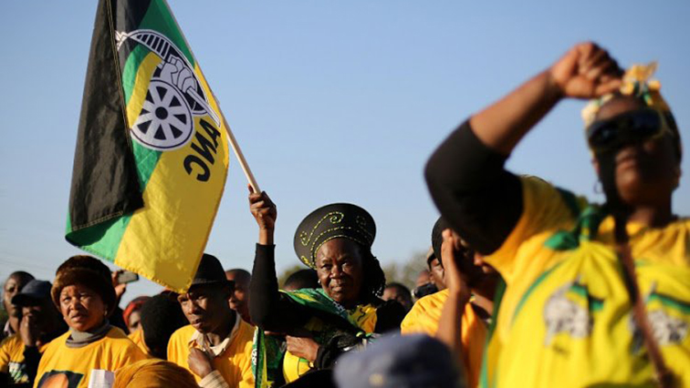 [File Image] Supporters of the African National Congress hold the party flag during campaigning.