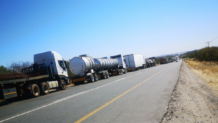 Trucks wait in line at a border post