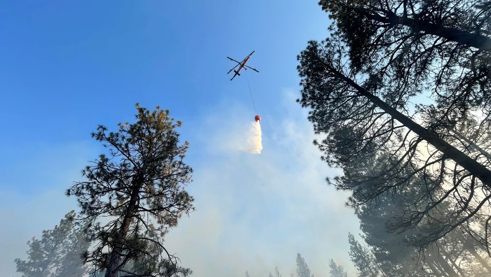 An aircraft flies over the Bootleg Fire as it rages in Klamath and Lake Counties, in Oregon, U.S., July 14, 2021. Picture taken July 14, 2021. OSFM Green Incident Management Team via REUTERS