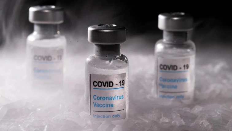 FILE PHOTO: Vials labelled "COVID-19 Coronavirus Vaccine" are placed on dry ice in this illustration taken, December 4, 2020. Picture taken December 4, 2020.