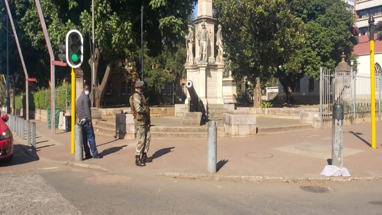 A member of the SANDF is seen guarding a national key point in Pietermaritzburg.