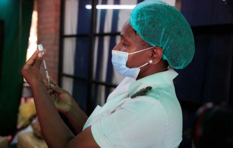 A nurse prepares a dose of the Sinopharm coronavirus disease (COVID-19) vaccine at Wilkins Hospital in Harare, Zimbabwe, March 24, 2021.