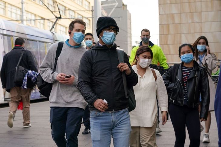Commuters wear protective face masks as they enter Central Station following the implementation of new public health regulations from the state of New South Wales, as the city grapples with an outbreak of the coronavirus disease (COVID-19) in Sydney, Australia, on June 23, 2021.