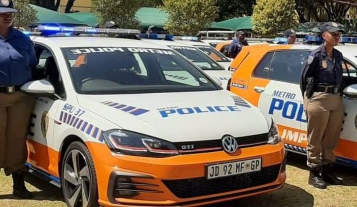 Female JMPD officers next to their vehicles