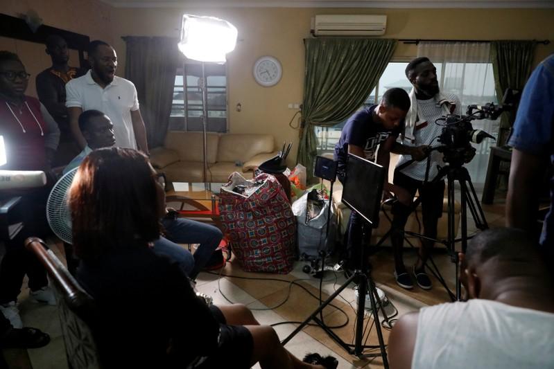 Crew members film a scene on the set of a ROK's film in Lagos, Nigeria July 21, 2019.