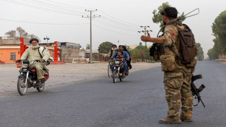 A member of the Afghan Special Forces directs traffic during the rescue mission.
