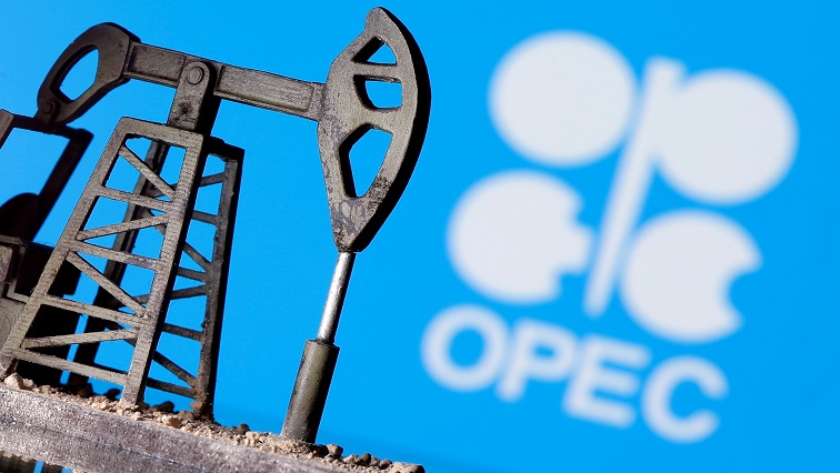 A 3D-printed oil pump jack is seen in front of displayed OPEC logo in this illustration picture.
