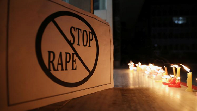 A poster is seen at a candle-light march by the resident doctors and medical students from All India Institute of Medical Sciences (AIIMS) to protest against the alleged rape and murder of a 27-year-old woman on the outskirts of Hyderabad, in New Delhi, India, December 3, 2019.