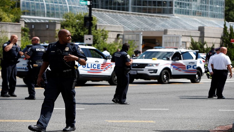 Police officers man a police barricade while responding to a bomb threat near the US Capitol in Washington, US, August 19, 2021.