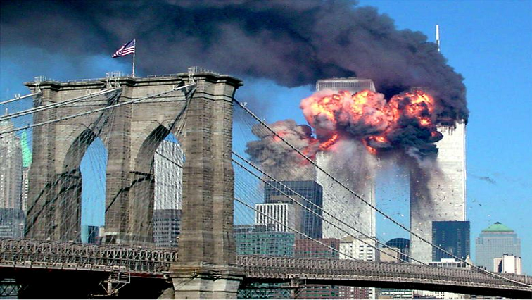 The second tower of the World Trade Center bursts into flames after being hit by a hijacked airplane, September 11, 2001. REUTERS/Sara K. Schwittek