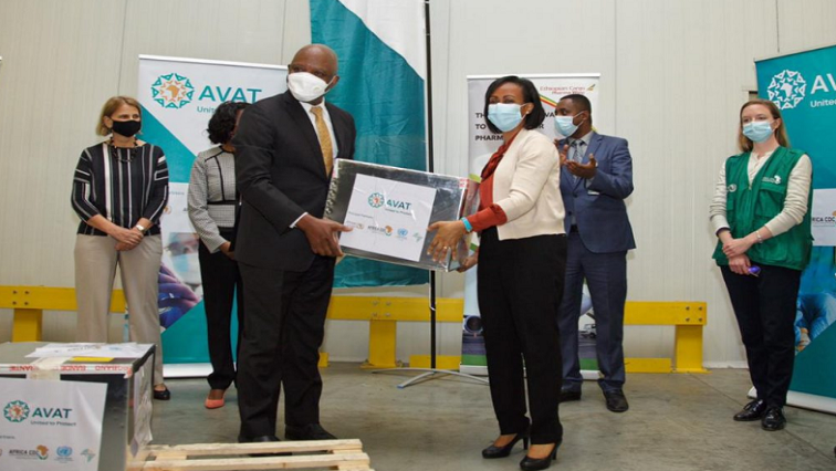 Africa CDC Director, Dr John Nkengasong hands over Johnson & Johnson COVID-19 vaccines to the Minister of Health of the Federal Democratic Republic of Ethiopia Lia Tadesse.