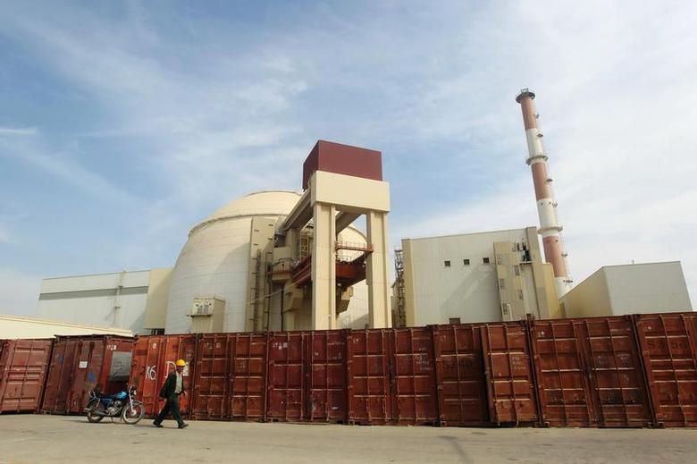 A Russian worker walks past the Bushehr nuclear power plant in Iran, October 26, 2010