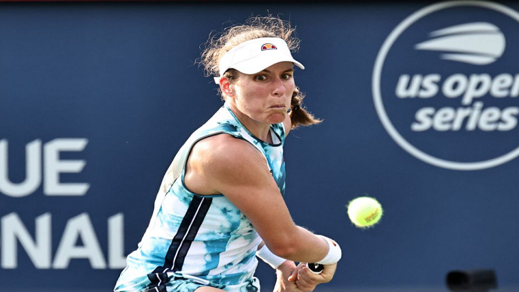 Johanna Konta from Great Britain hits a shot against Elina Svitolina from Ukrania (not pictured) during the second round play at Stade IGA, August 11, 2021.