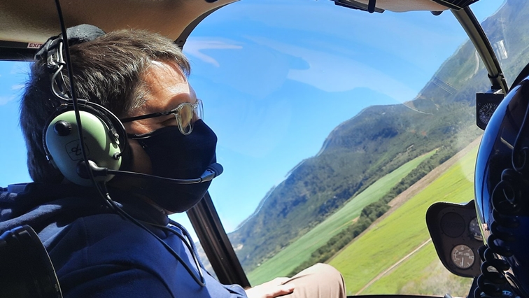Western Cape Minister of Tourism, David Maynier on a  helicopter ride over the Overberg mountains for a glimpse of the zipline route.