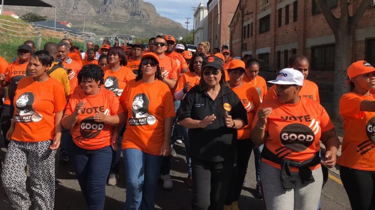 GOOD Party members walk in Cape Town.