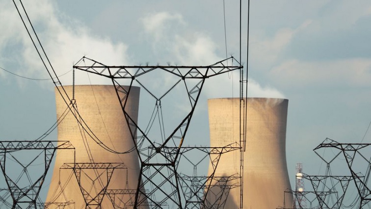 Cooling towers are pictured at a coal-based power station owned by state power utility Eskom in Duhva, South Africa, February 18, 2020