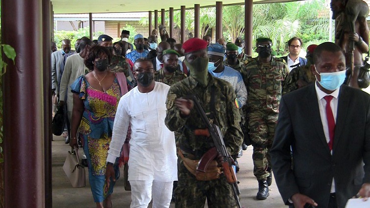 Envoys from the Economic Community of West African States (ECOWAS) for the Guinea crisis are escorted out after their meeting with special forces commander Mamady Doumbouya, who ousted President Alpha Conde in Conakry, Guinea.