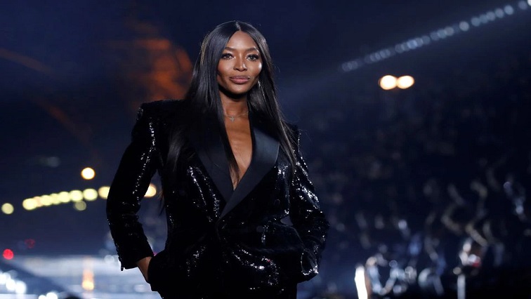 Naomi Campbell presents a creation by designer Anthony Vaccarello as part of his Spring/Summer 2020 women's ready-to-wear collection show for fashion house Saint Laurent during Paris Fashion Week in Paris, France.