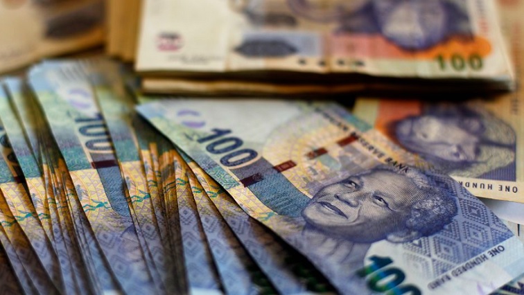 South African bank notes are displayed at an office in Johannesburg.