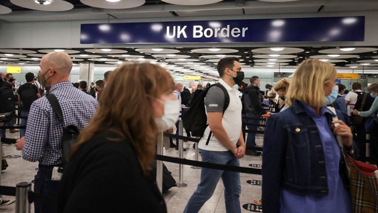 Arriving passengers queue at UK Border Control at the Terminal 5 at Heathrow Airport in London, Britain June 29, 2021.
