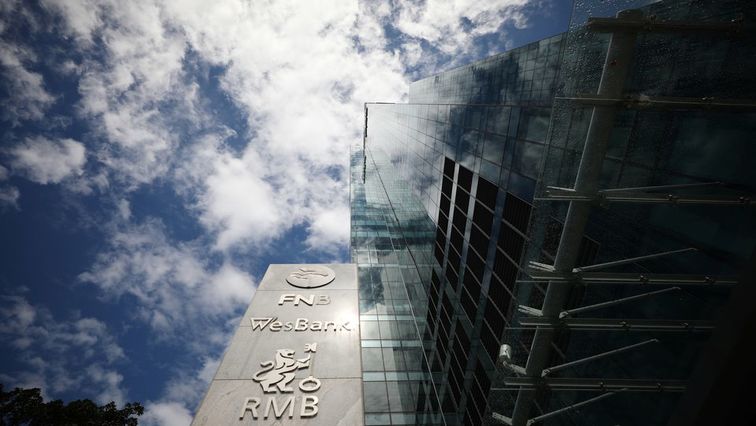 The logos of companies Rand Merchant Bank, FNB, and Wesbank are seen outside the FirstRand offices in Cape Town, South Africa, March 11, 2019.