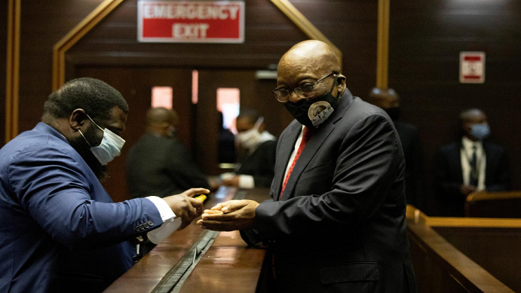 Former President Jacob Zuma sanitising his hands in the Pietermaritzburg High Court.