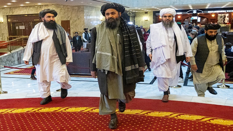 FILE PHOTO: Mullah Abdul Ghani Baradar, the Taliban's deputy leader and negotiator, and other delegation members attend the Afghan peace conference in Moscow, Russia March 18, 2021.