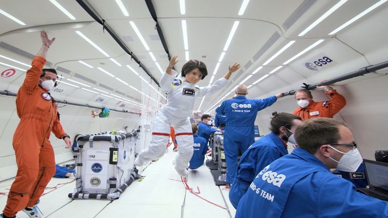 A Barbie doll version of an Italian astronaut Samantha Cristoforetti is seen during a zero-gravity flight with members of the European Space Agency in an unknown location.