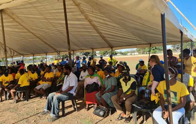 ANC supporters sit under a marquee during a campaign event in KZN