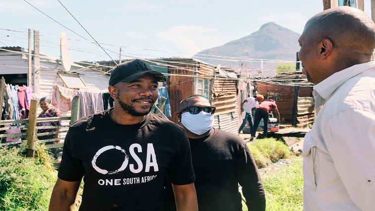 One SA Leader Mmusi Maimane is pictured wearing the movement's t-shirt.